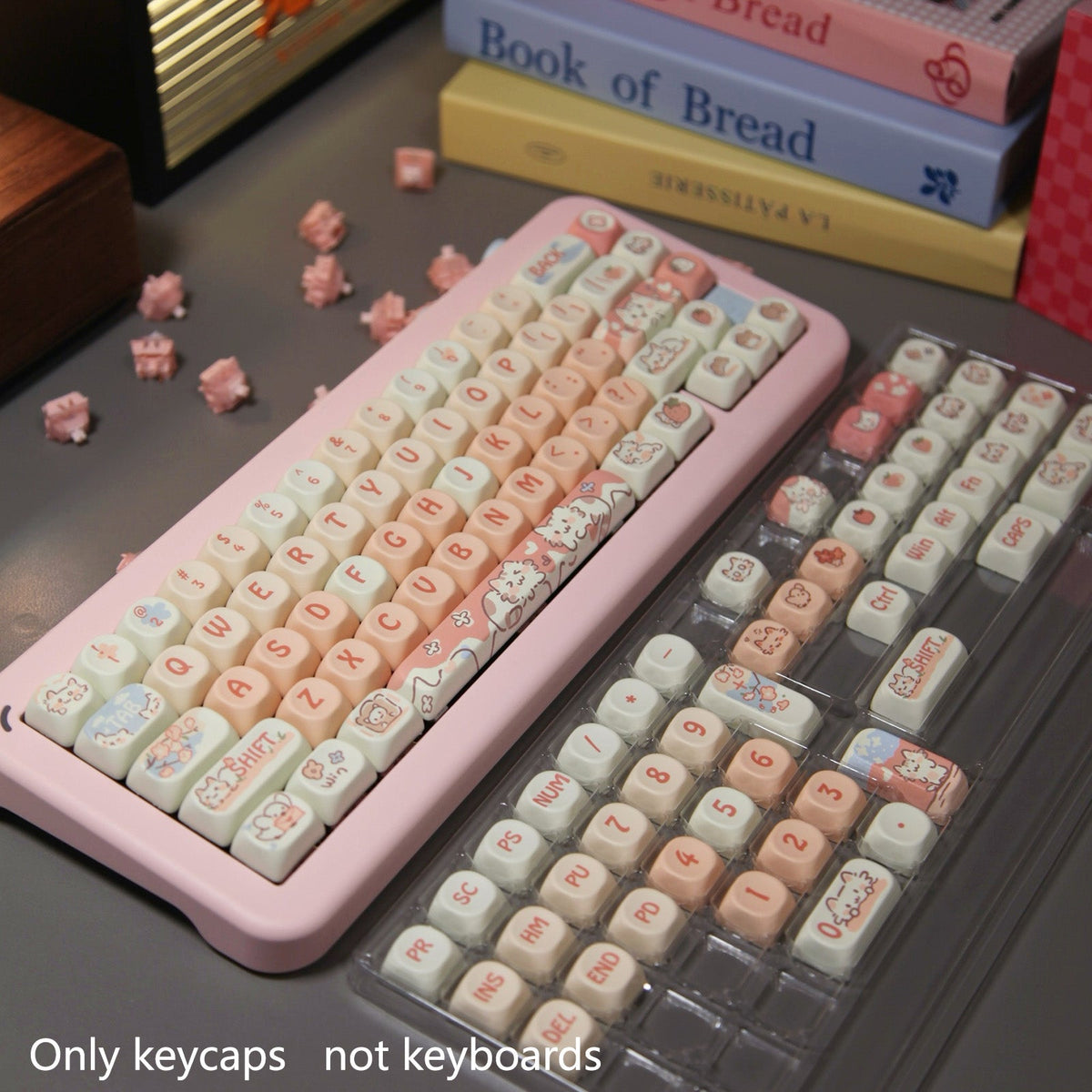 Strawberry Cat keycaps installed with extra keys shown beside the keyboard